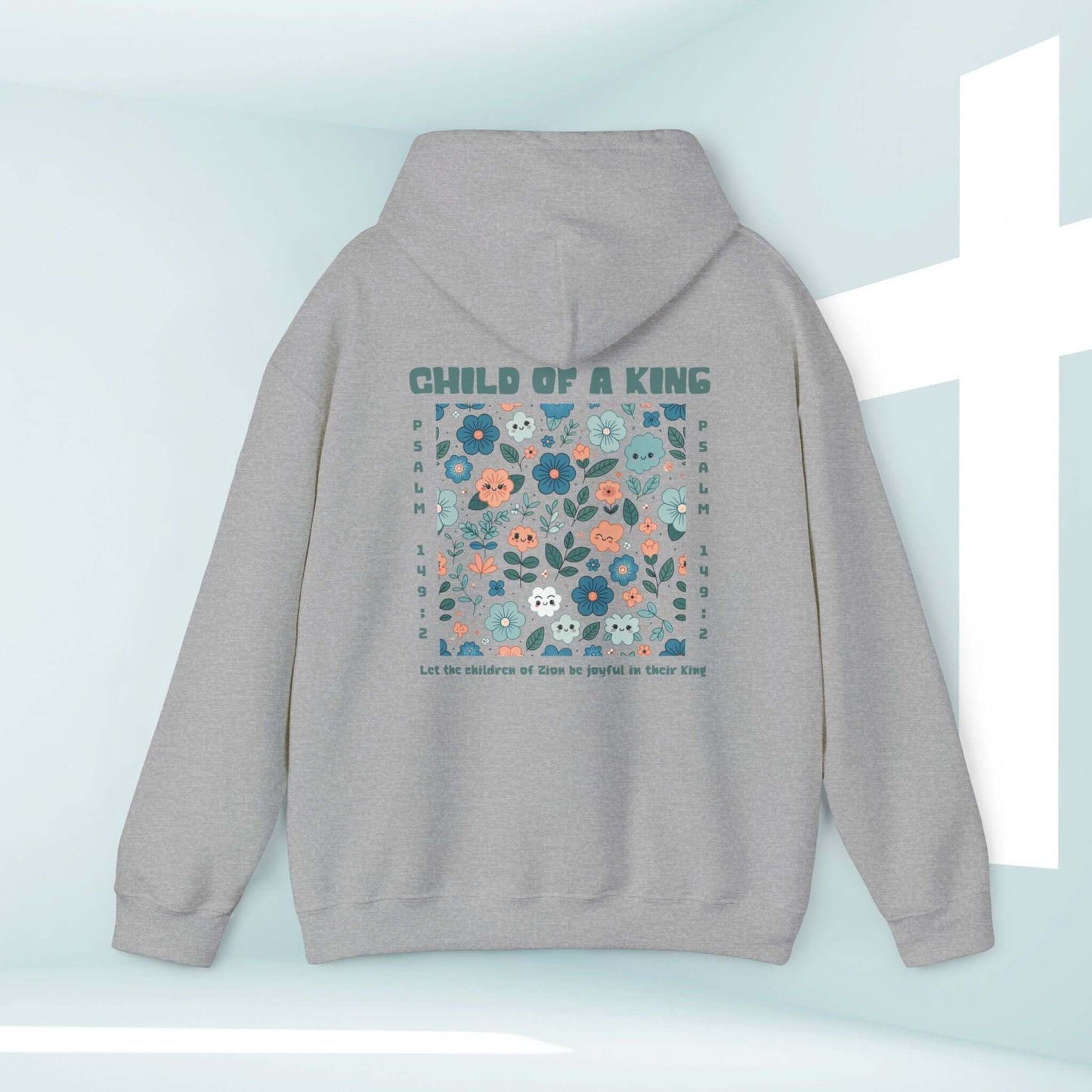 Cozy Child Of A King Christian hoodie with Bible verse and floral design on a beachy background. Perfect religious apparel for kids.