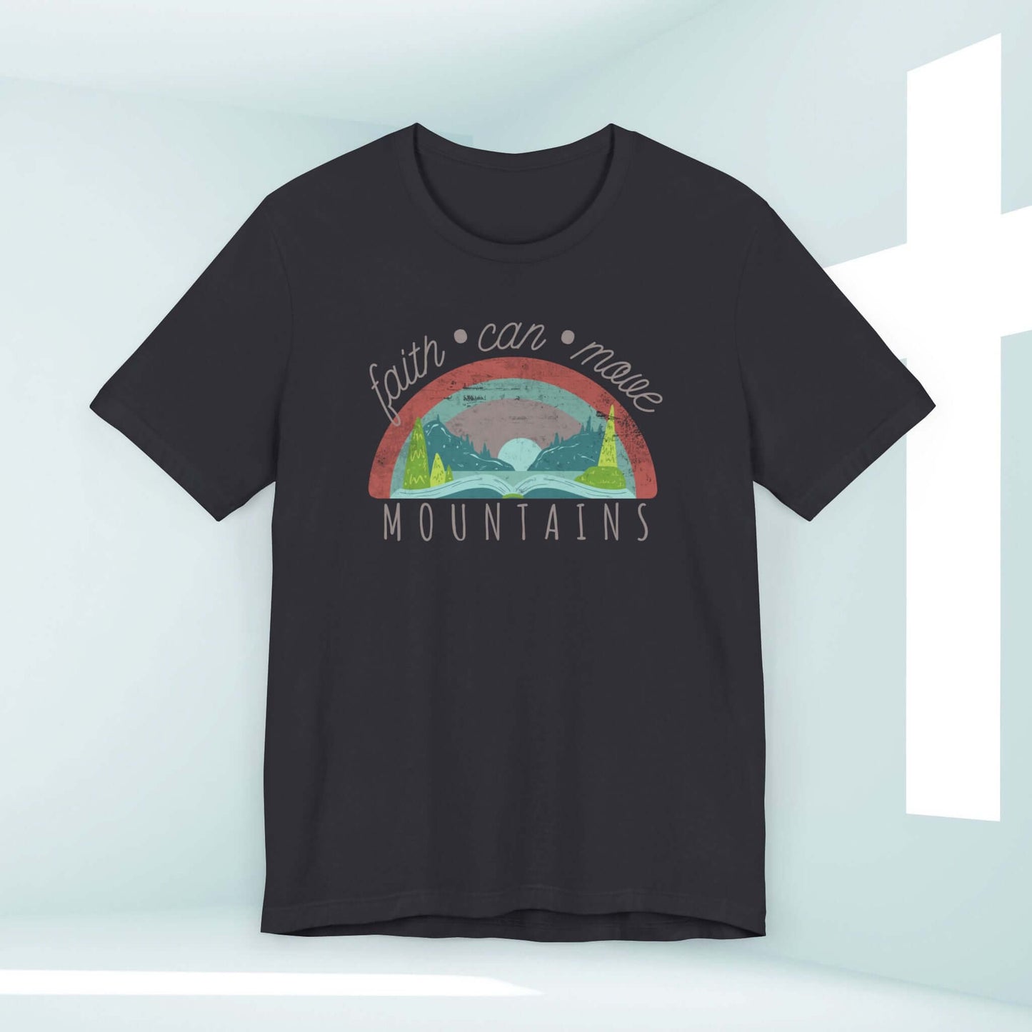 Women's Christian T-Shirt with 'Faith Can Move Mountains' rainbow design, perfect as religious gift or Christian apparel, displayed on hanger.