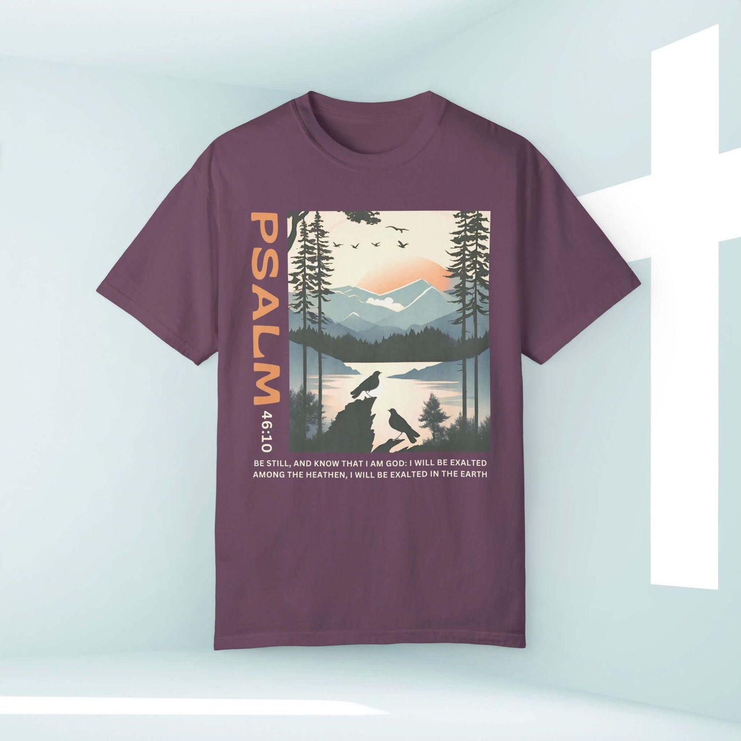 Peace Be Still Birds Christian t-shirt with Psalm 46:10, featuring serene nature scene and cross, inspirational faith-based tee in dark purple