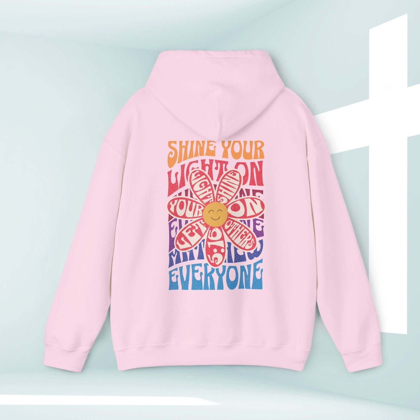 Shine Your Light boho Christian hoodie with smiley face flower design and Bible verse, faith-based inspirational religious pullover sweatshirt.