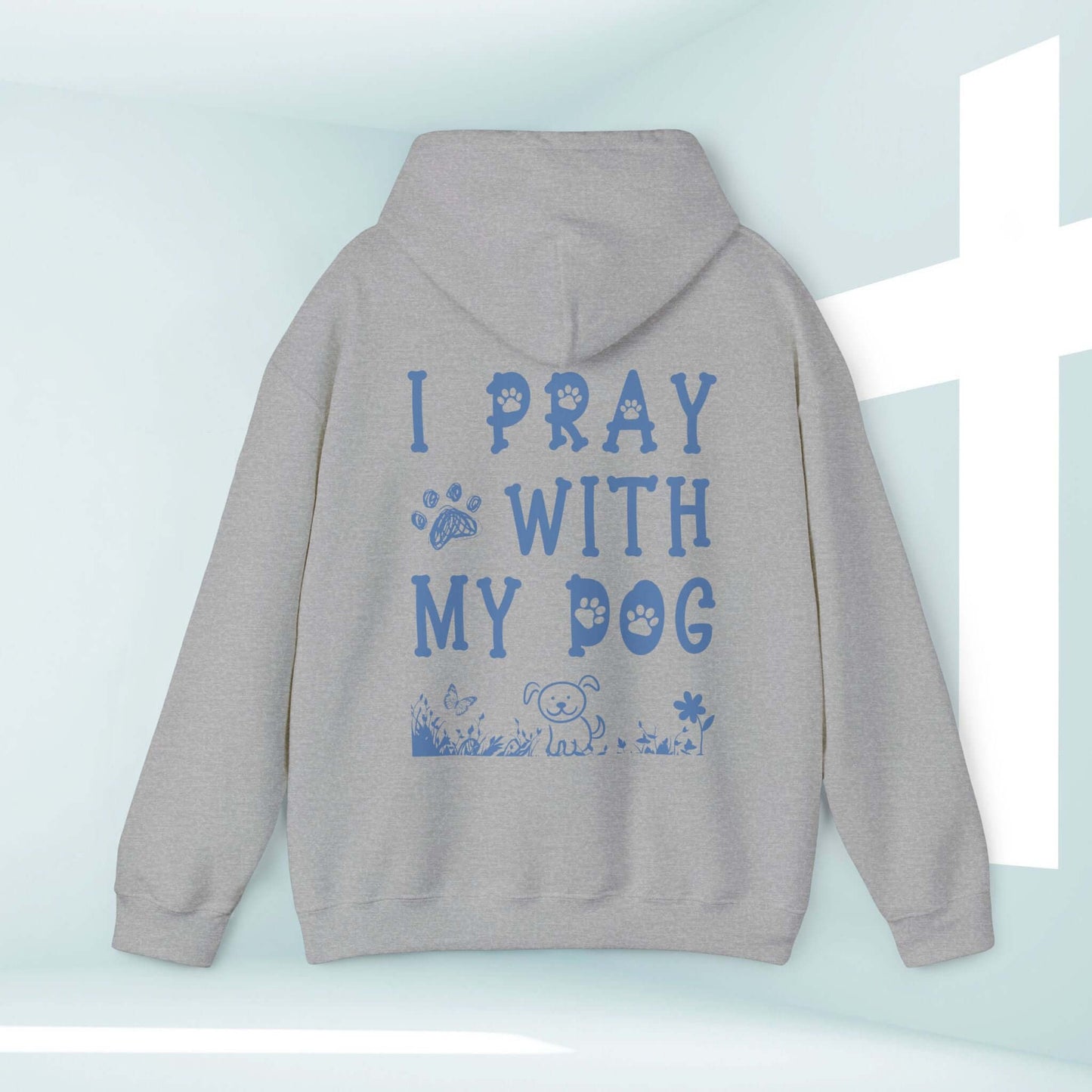 "I Pray With My Dog Christian Hoodie in gray, featuring faith-based graphic and paw prints for dog lovers and prayer enthusiasts."