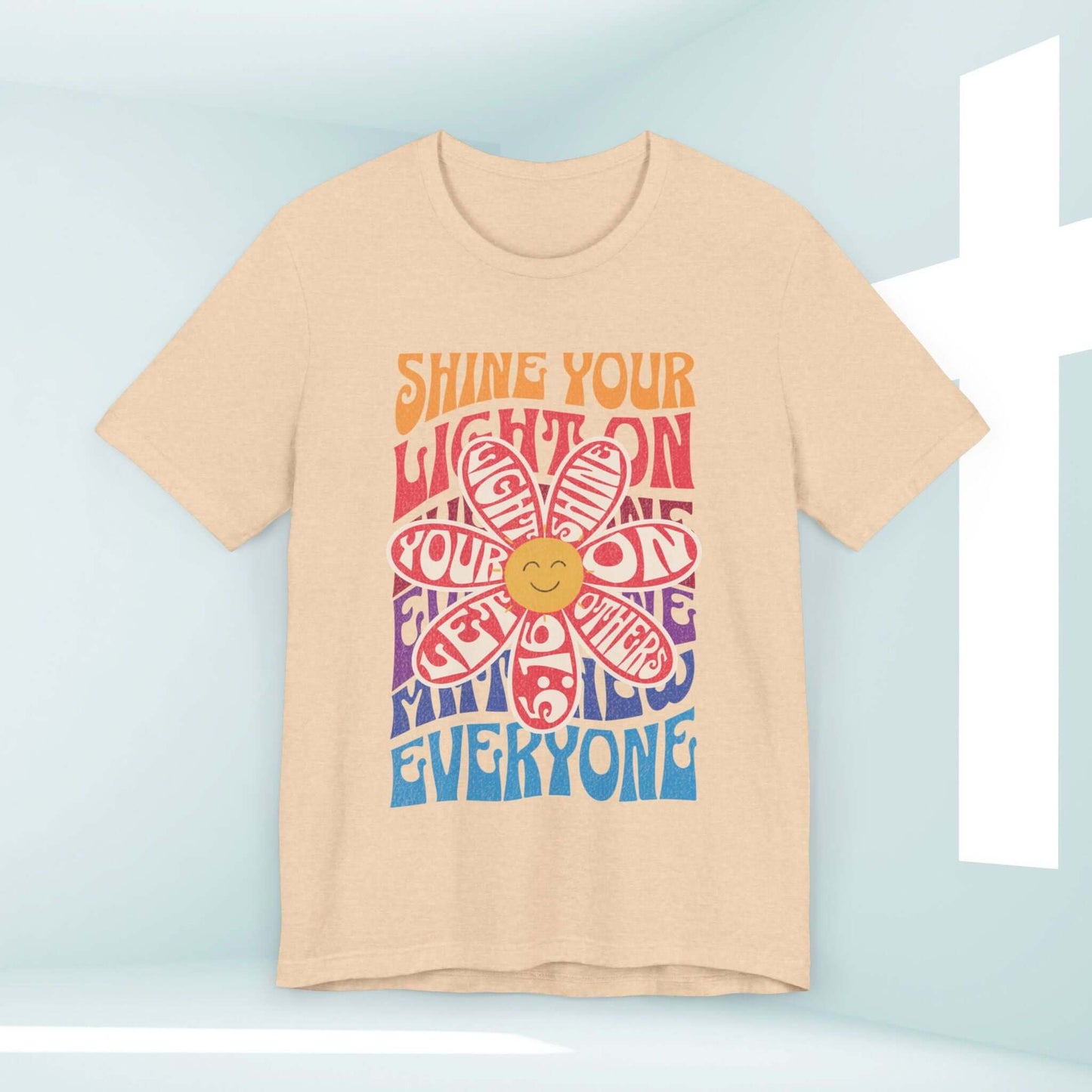 Shine Your Light Christian shirt with colorful flower graphic and inspirational message for faith, hope, and love.