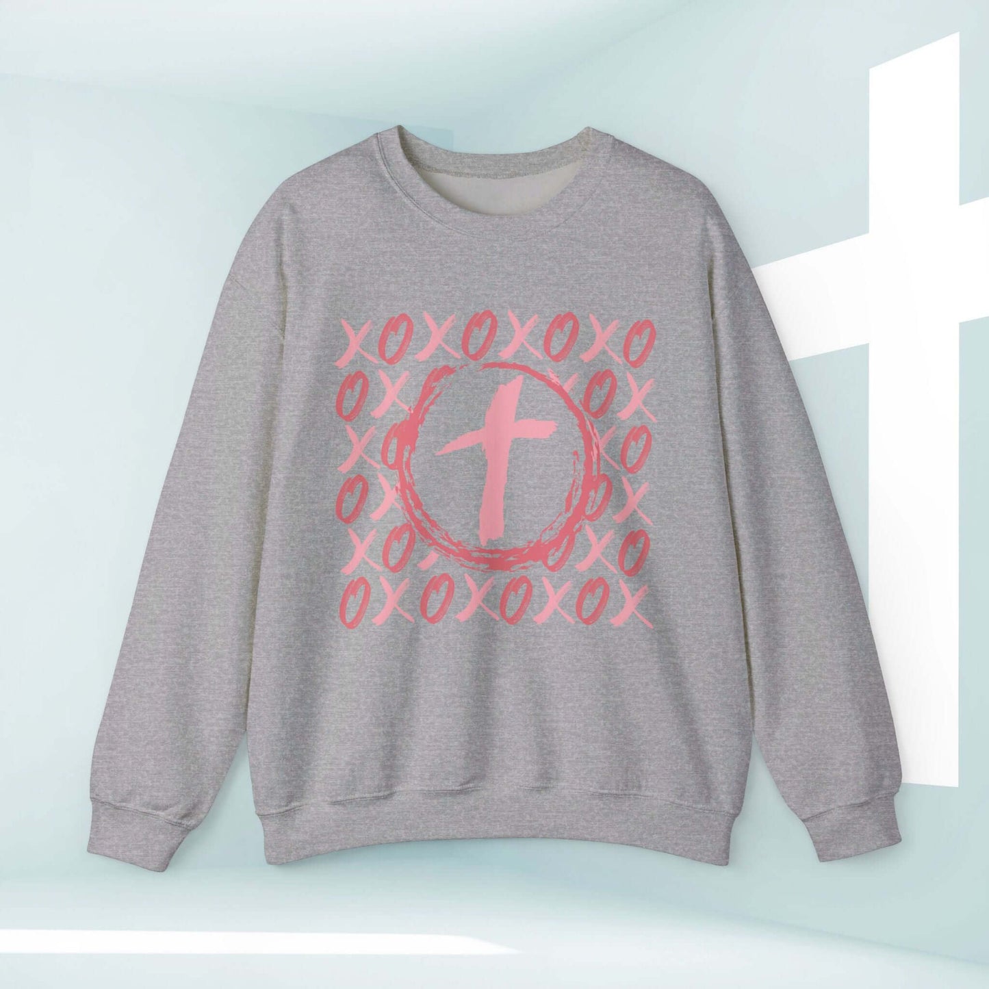 Christian wedding love sweatshirt with pink XOXO and cross design, perfect Valentine's Day faith-based gift.