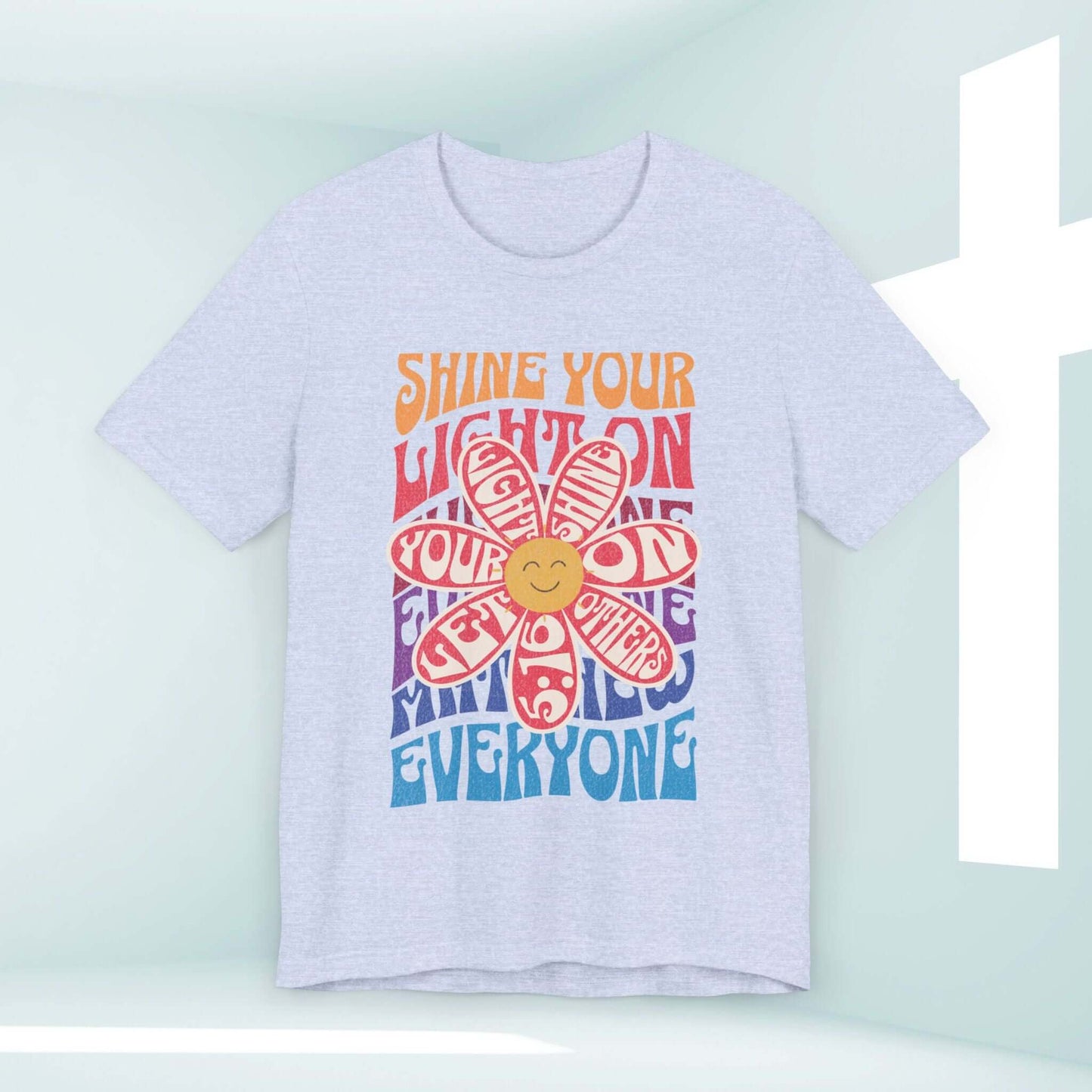 Shine Your Light Christian shirt with colorful retro flower design and inspirational message, perfect for spreading faith and love.