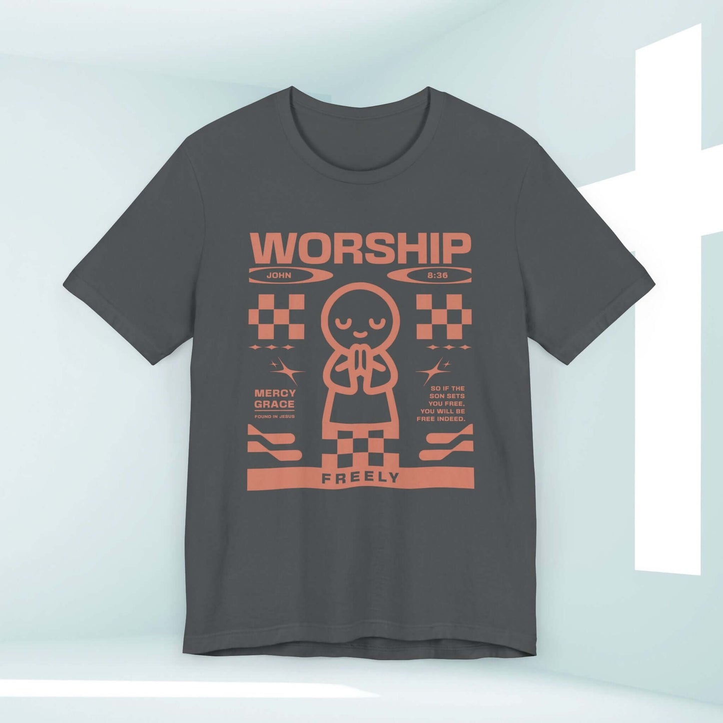 Worship Freely Christian t-shirt with graphic design featuring person praying, promoting faith, hope, and love.