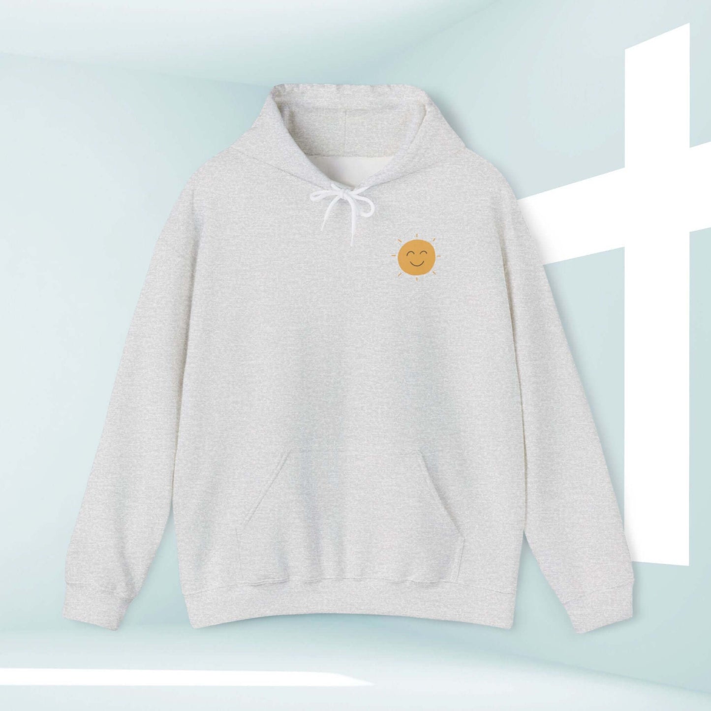 Christian boho hoodie with smiley face in front of a cross, inspirational faith-based hooded sweatshirt for believers.