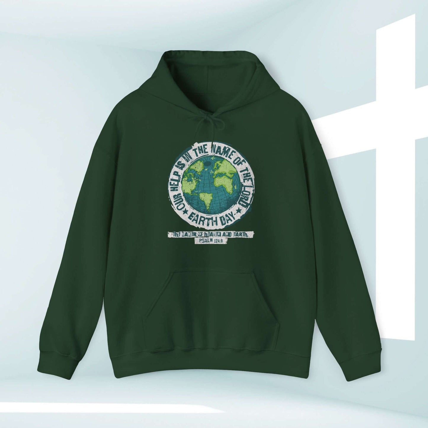 Dark green Earth Day Christian hoodie with Bible verse "Our Help Is" featured in outdoor-themed design.