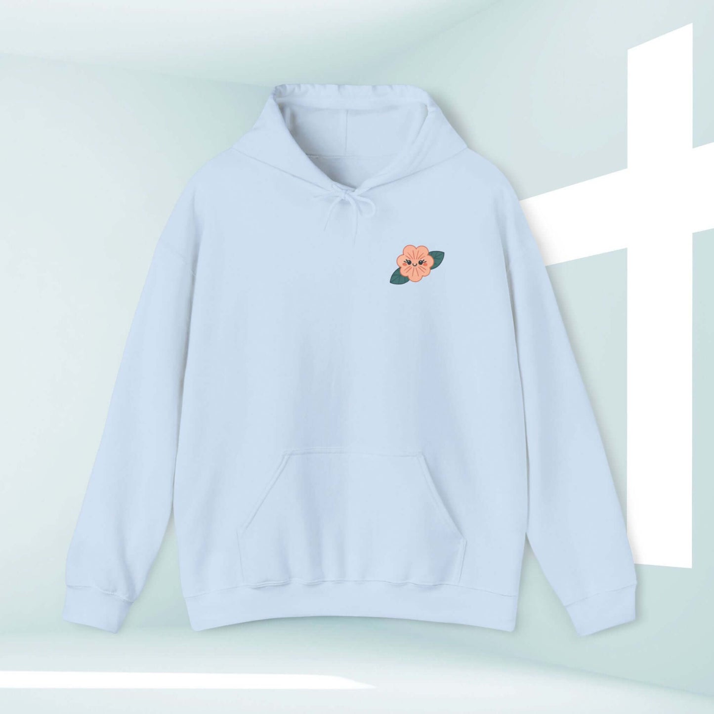 Light blue Christian hoodie with flower embroidery, displayed with a white cross background, perfect for an inspirational and faith-based beach sweater look.