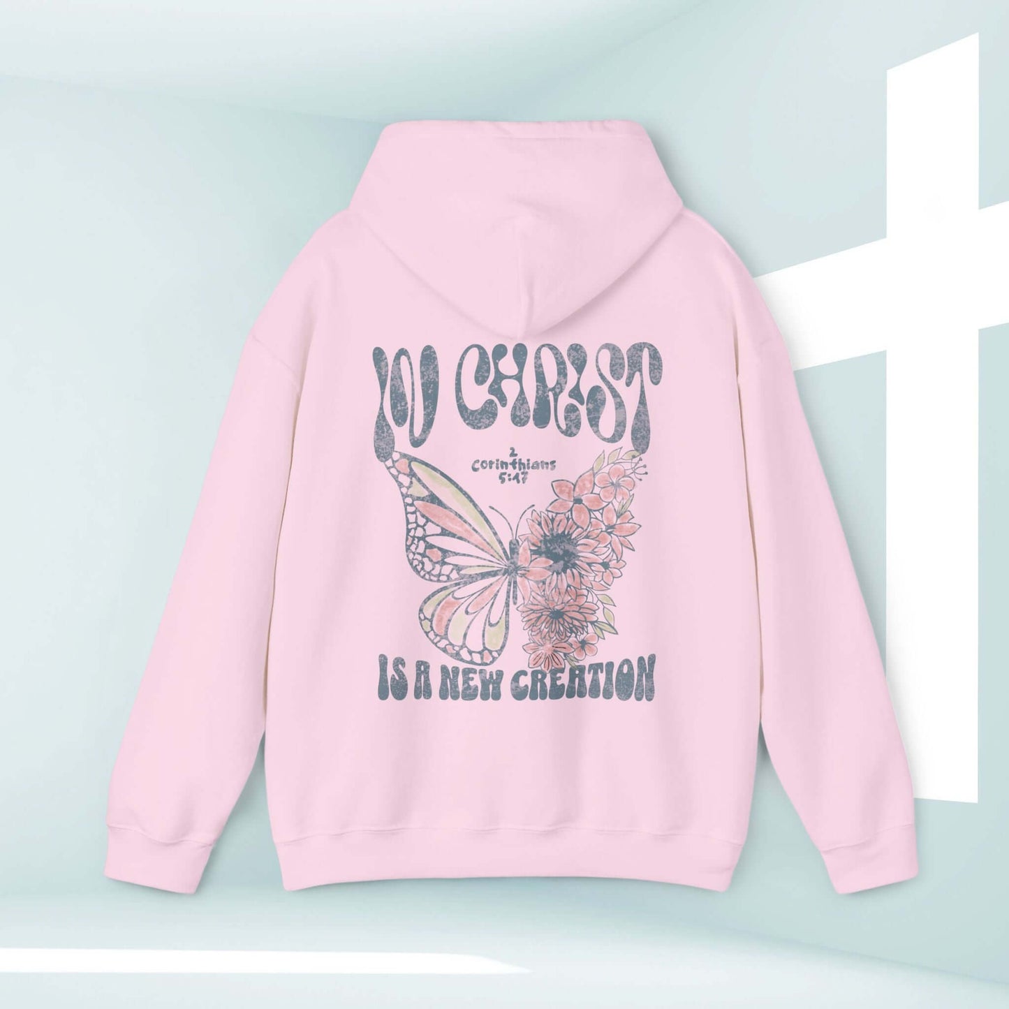 Pink Butterfly Christian Hoodie with "In Christ Is A New Creation" Bible verse design, faith-based sweatshirt, inspirational and religious apparel.