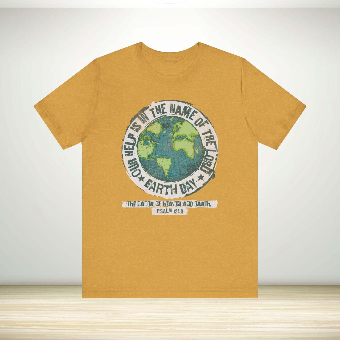 "Christian Earth Day shirt with globe graphic and Psalm 124:8 text on mustard yellow tee, promoting Christian faith and eco-friendly message."