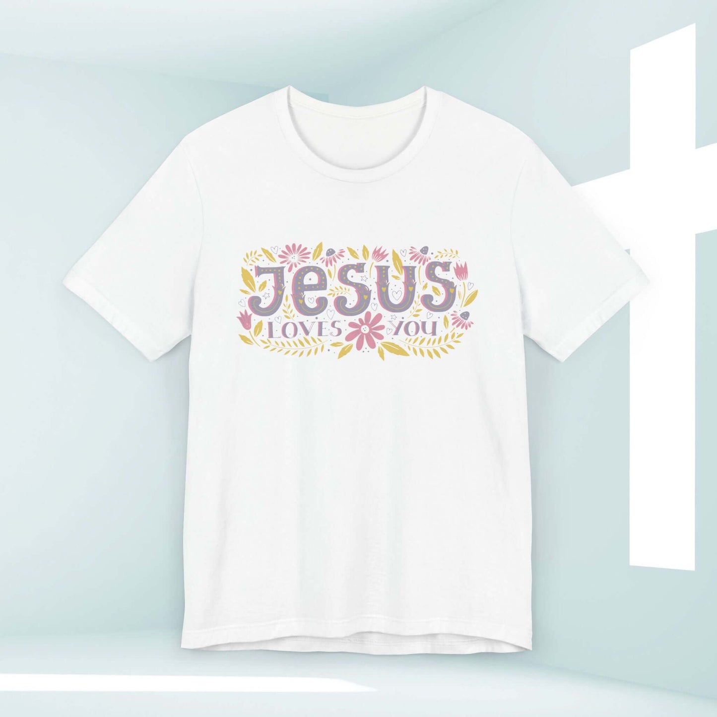 Women's white "Jesus Loves You" Christian tee with floral design, inspirational religious shirt for sharing faith and testimony.