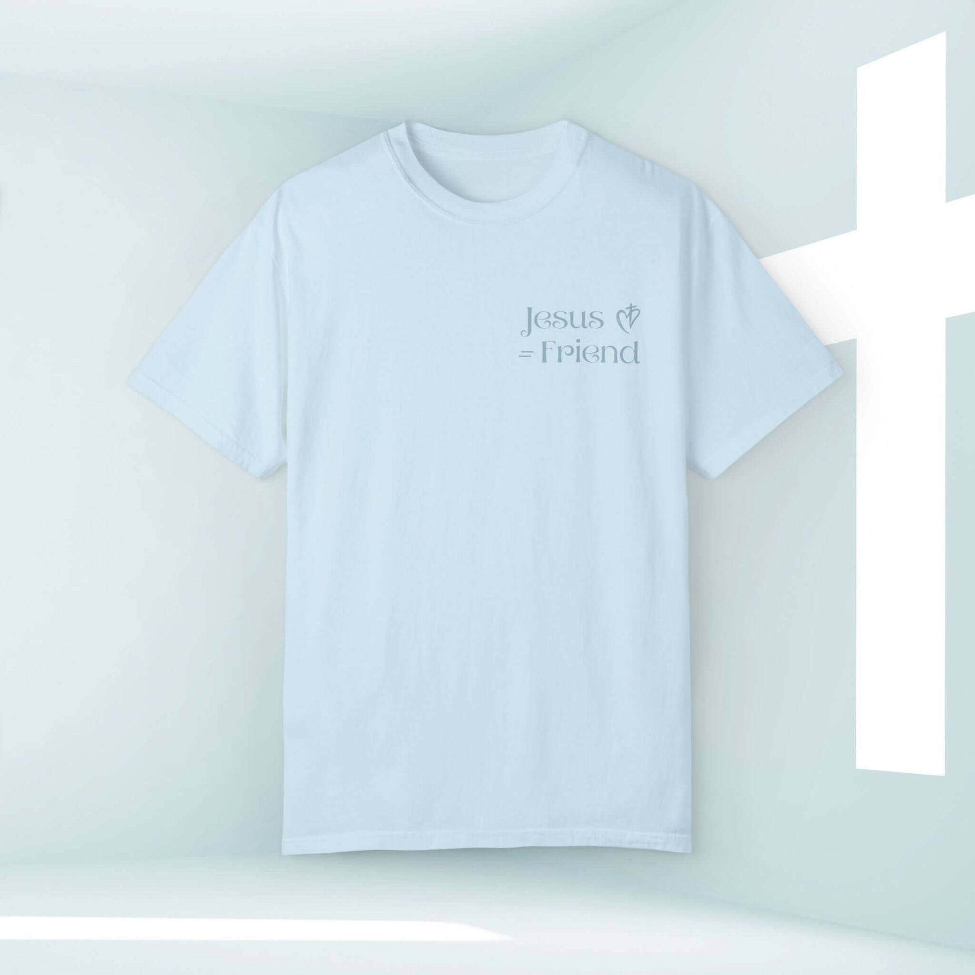 I Found A Friend In Jesus Christian t-shirt with inspirational message displayed against a light background with a cross.