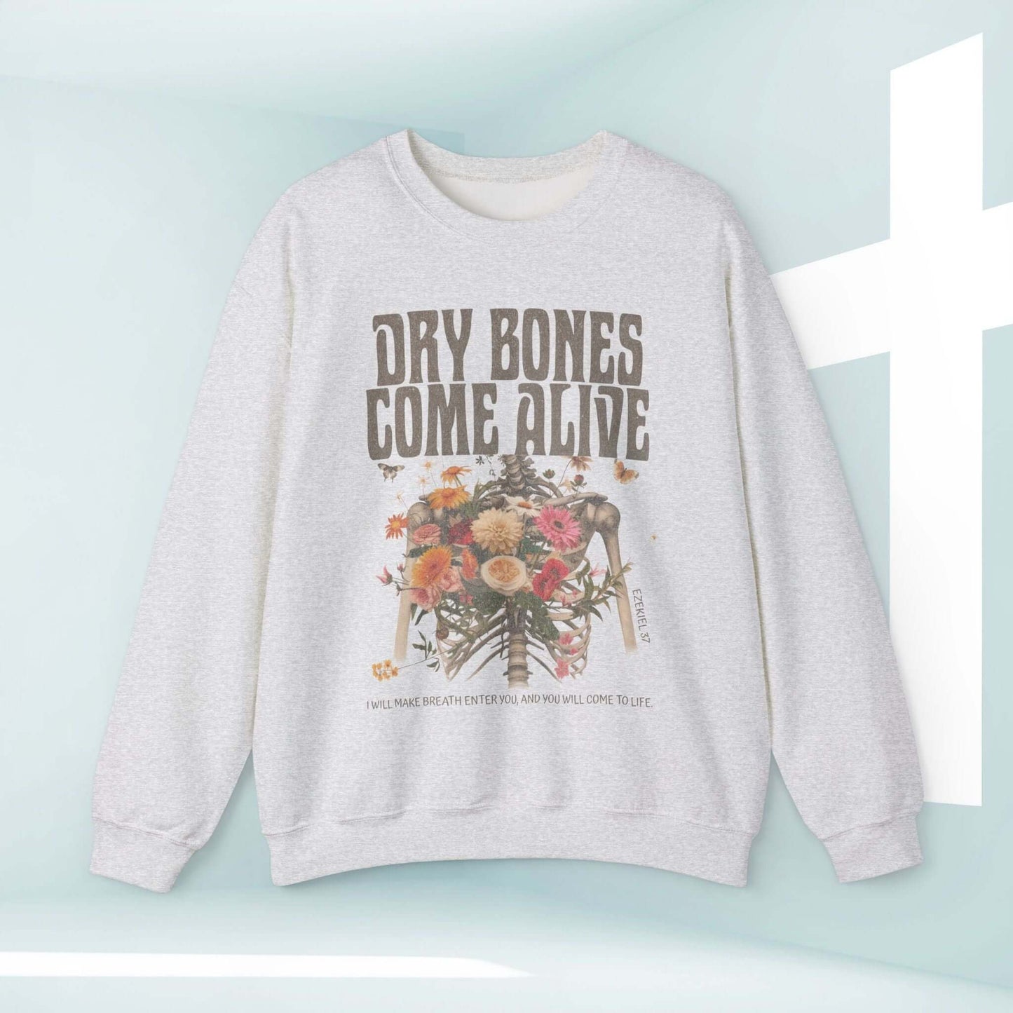 Christian Halloween sweatshirt with "Dry Bones Come Alive" design featuring a skeleton and floral motif, perfect for faith-inspired style.