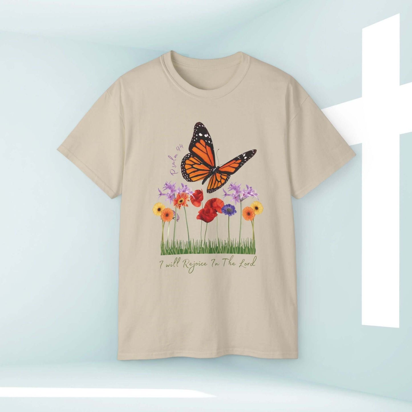 I Will Rejoice In The Lord Butterfly Floral Christian T-Shirt displayed against serene background with white cross.