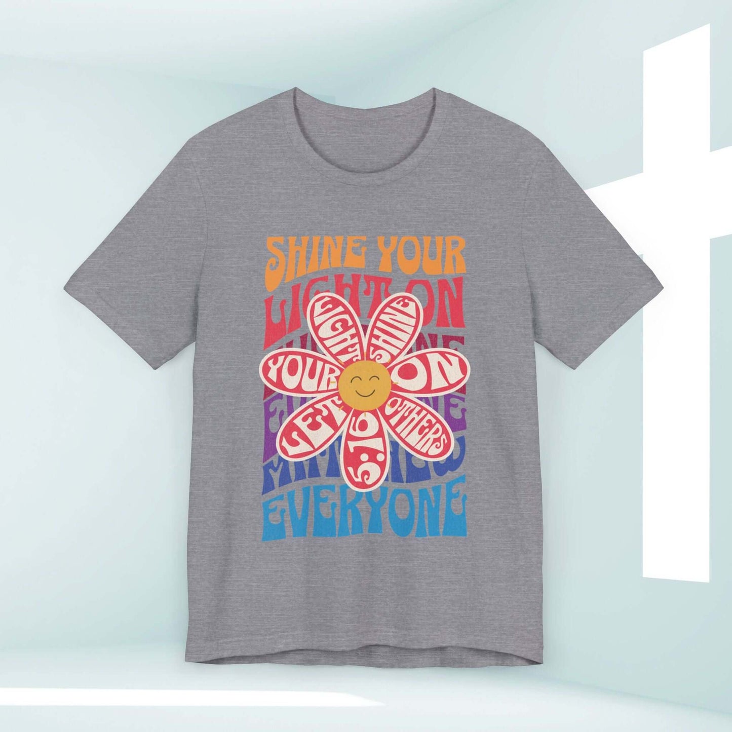 Shine Your Light Christian shirt with retro flower graphic, promoting faith, hope, and love. Perfect Bible verse and inspirational Christian apparel.