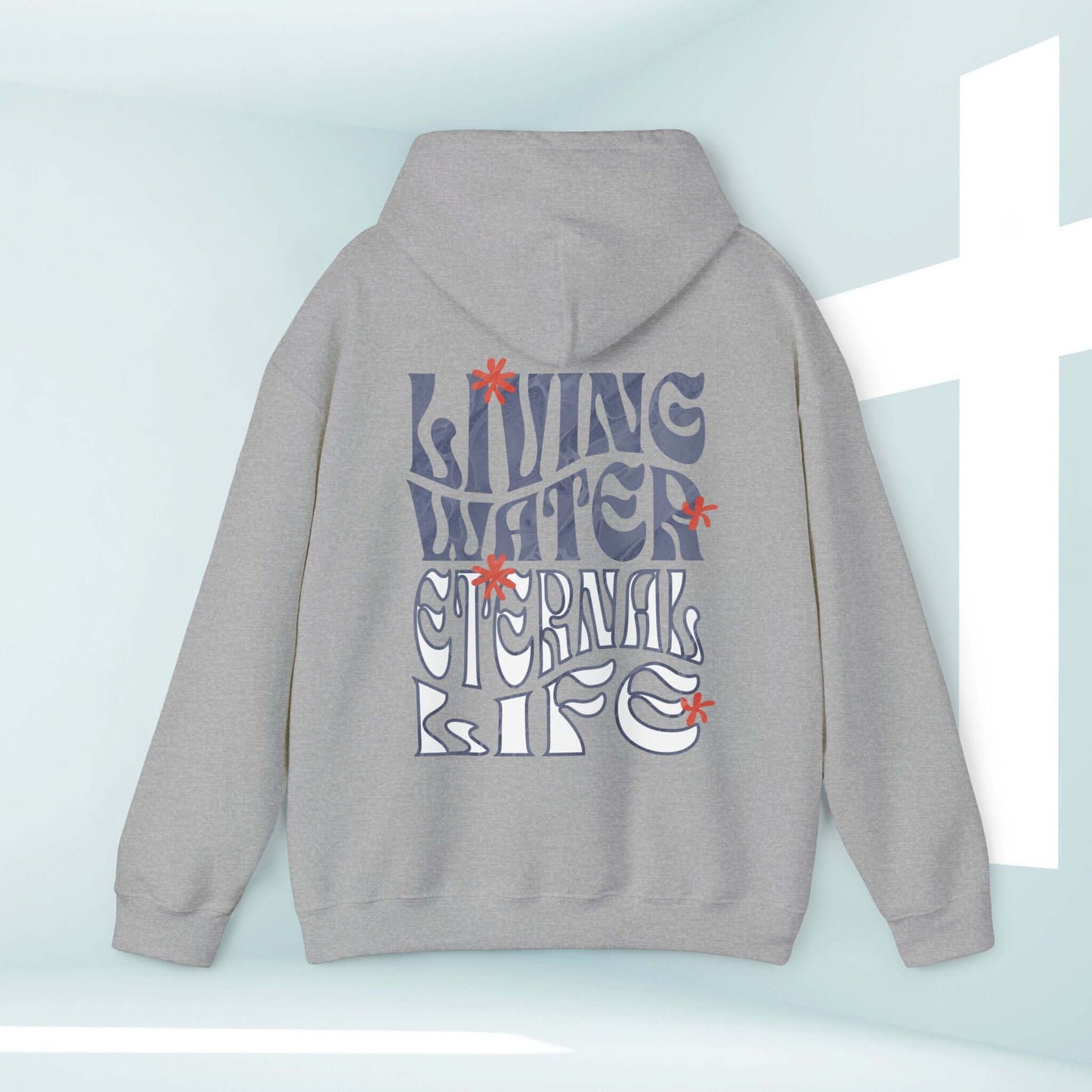 Gray Christian hoodie with "Living Water Eternal Life" text graphic, displayed in front of white cross.