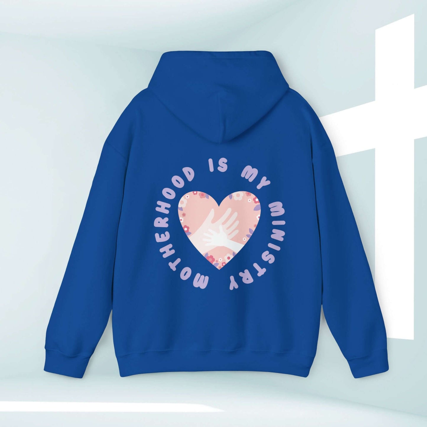 Blue Christian hoodie with "Motherhood Is My Ministry" text and heart design, perfect gift for new moms and homeschoolers