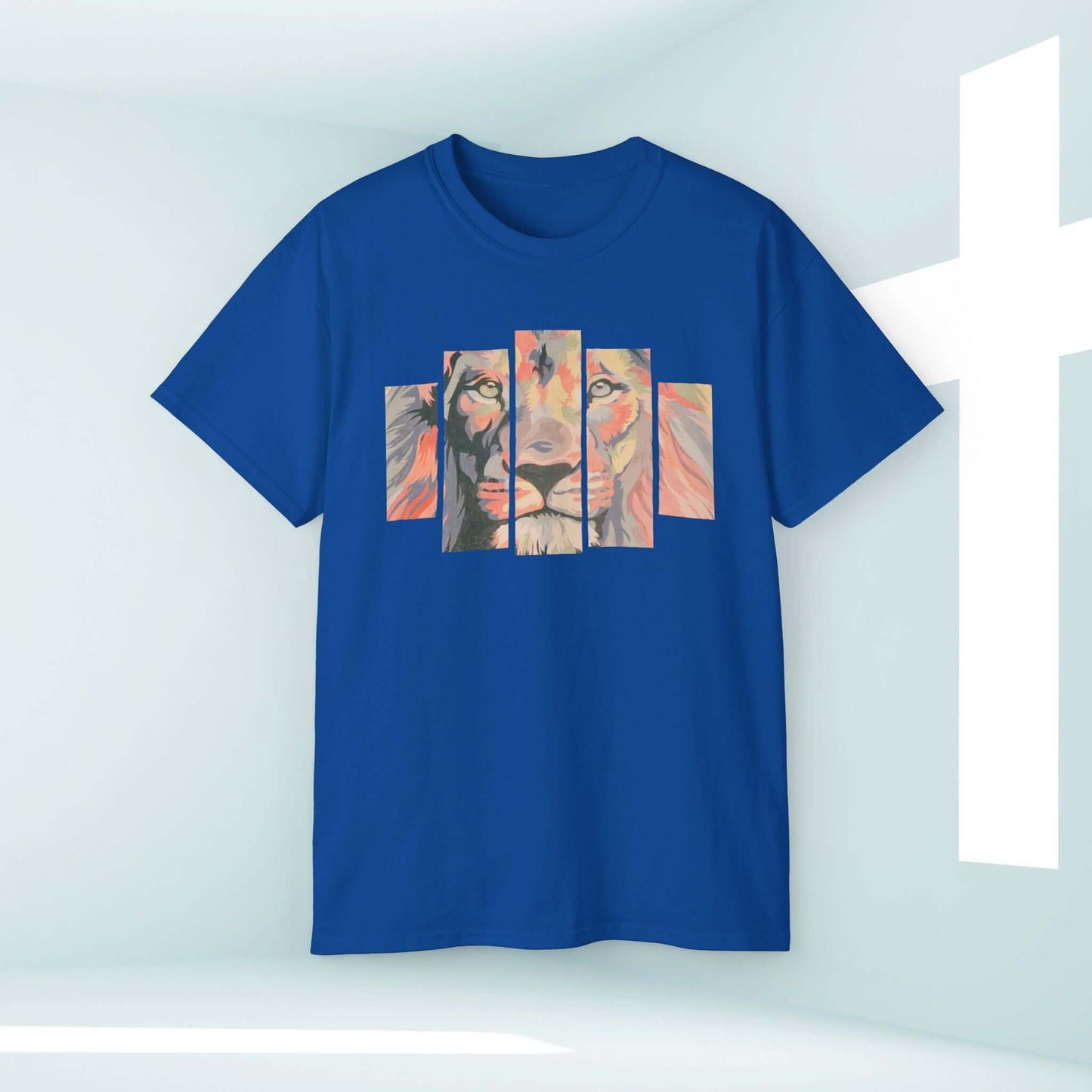 Blue Christian t-shirt with Lion of Judah design displayed on a hanger against a light background with a cross symbol.