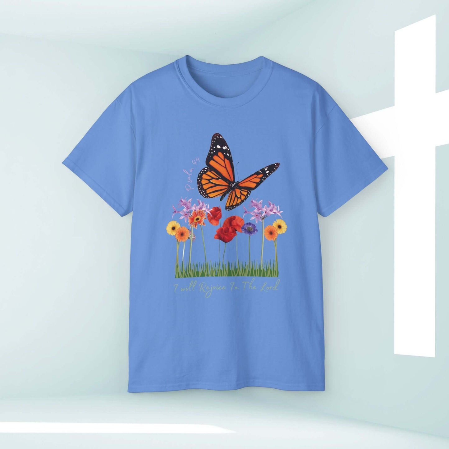 Blue Christian t-shirt with butterfly and floral design, scripture text 'I Will Rejoice In The Lord', inspirational faith-based apparel.