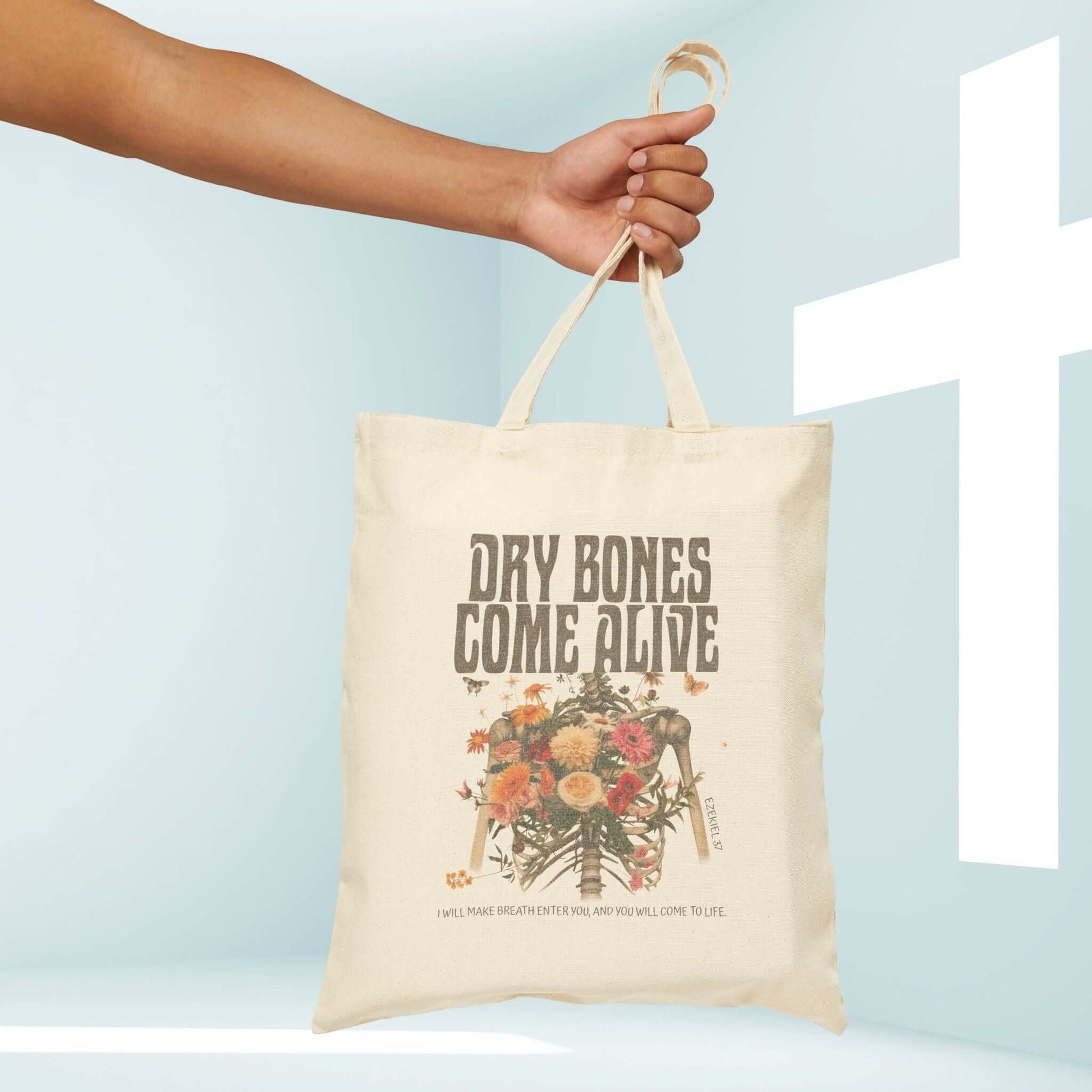 Christian Halloween tote bag with "Dry Bones Come Alive" design, featuring a cute skeleton and flowers, perfect for trick or treat.