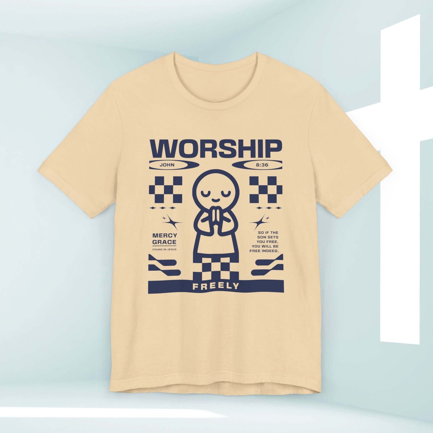 Beige Christian t-shirt with "Worship Freely" design and faith-based graphics, featuring religious text and a praying figure.