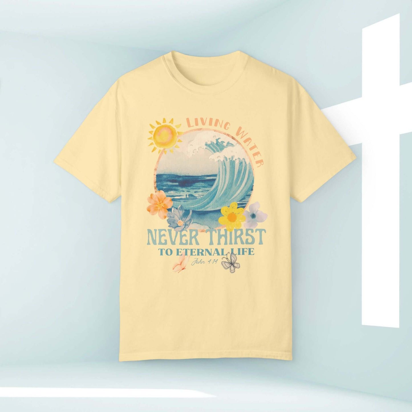 Living Water beach T-shirt with Bible verse, featuring a wave and sunshine design, promoting Christian faith and sustainable fashion.