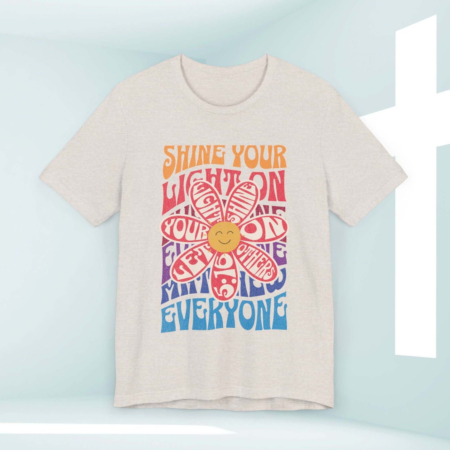 Inspirational retro Shine Your Light Christian t-shirt with colorful design and smiley face, perfect for faith-based and church activities.