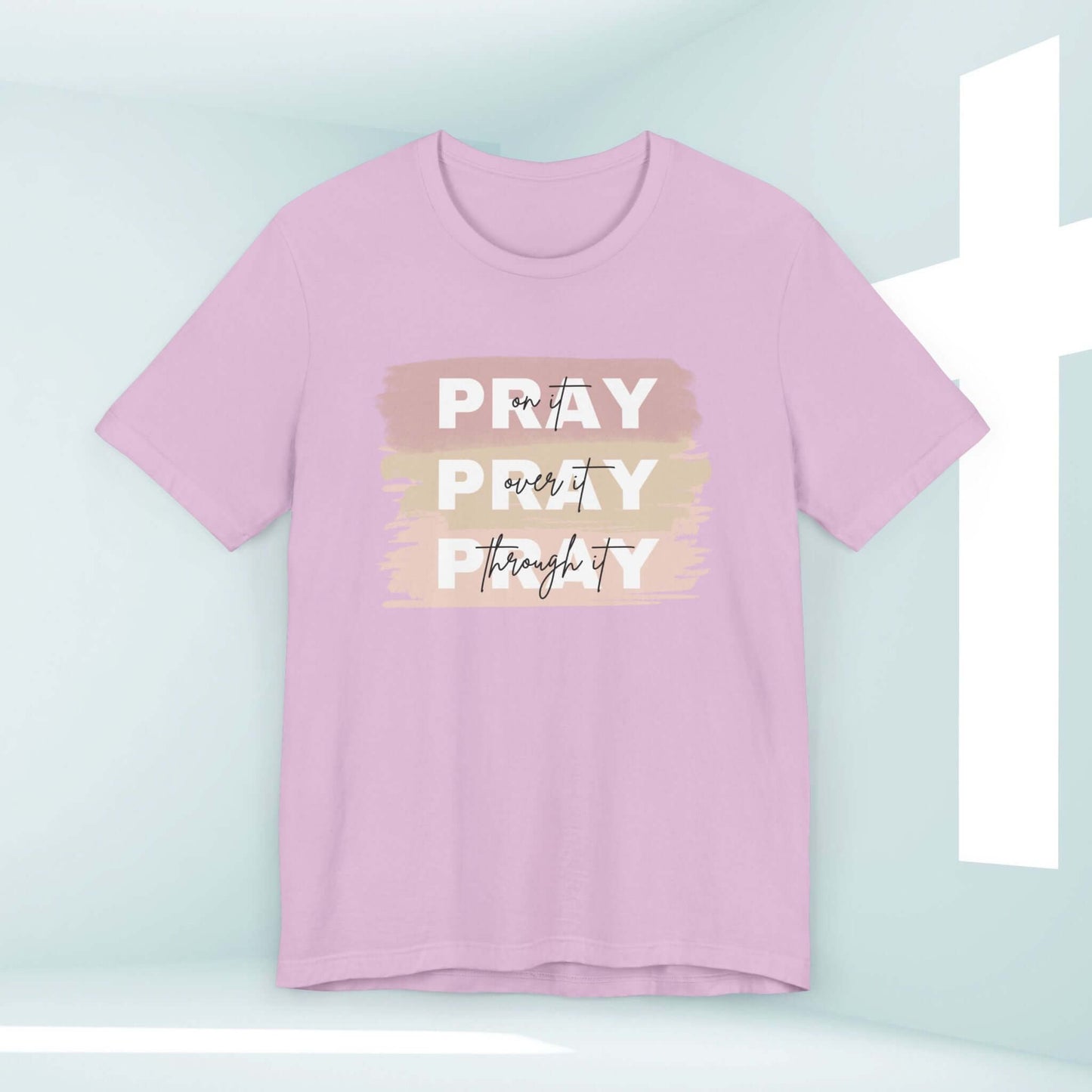 Pink women’s Christian t-shirt with "Pray On It, Over It, Through It" design, Christian clothing, inspirational Jesus shirt.