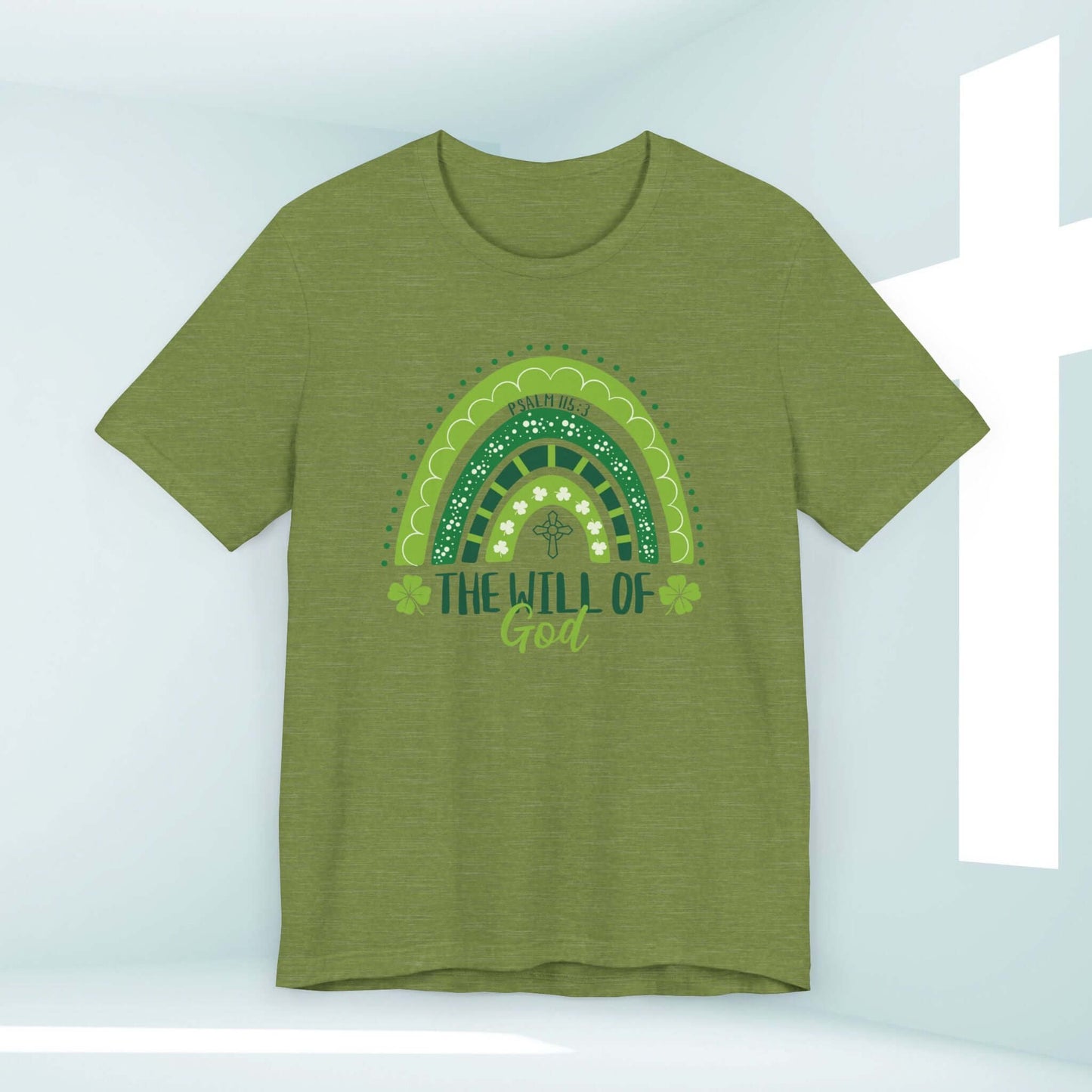 Green Christian St Patrick's Day shirt with shamrock rainbow and "The Will of God" design in a light-filled background.