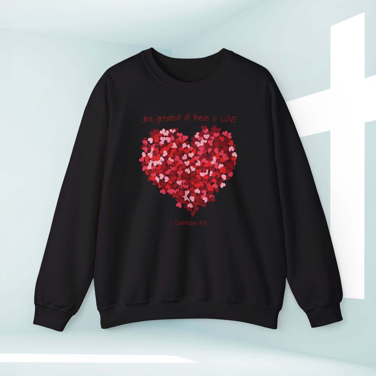 Black Christian sweatshirt with heart design and "Greatest of these is Love" Bible verse, perfect Valentine’s and wedding gift