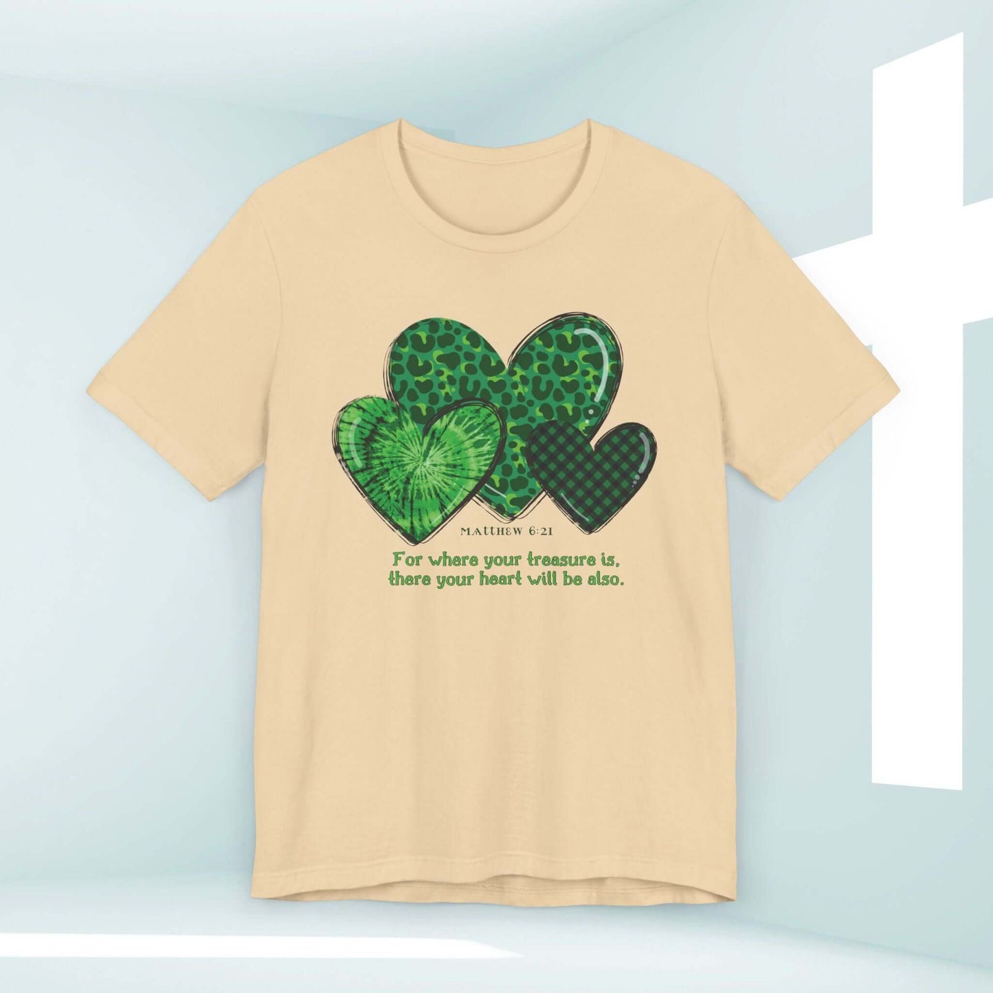 St Patrick's Day Christian Treasure Heart T-Shirt with Shamrock Clover Design and Bible Verse on beige fabric.