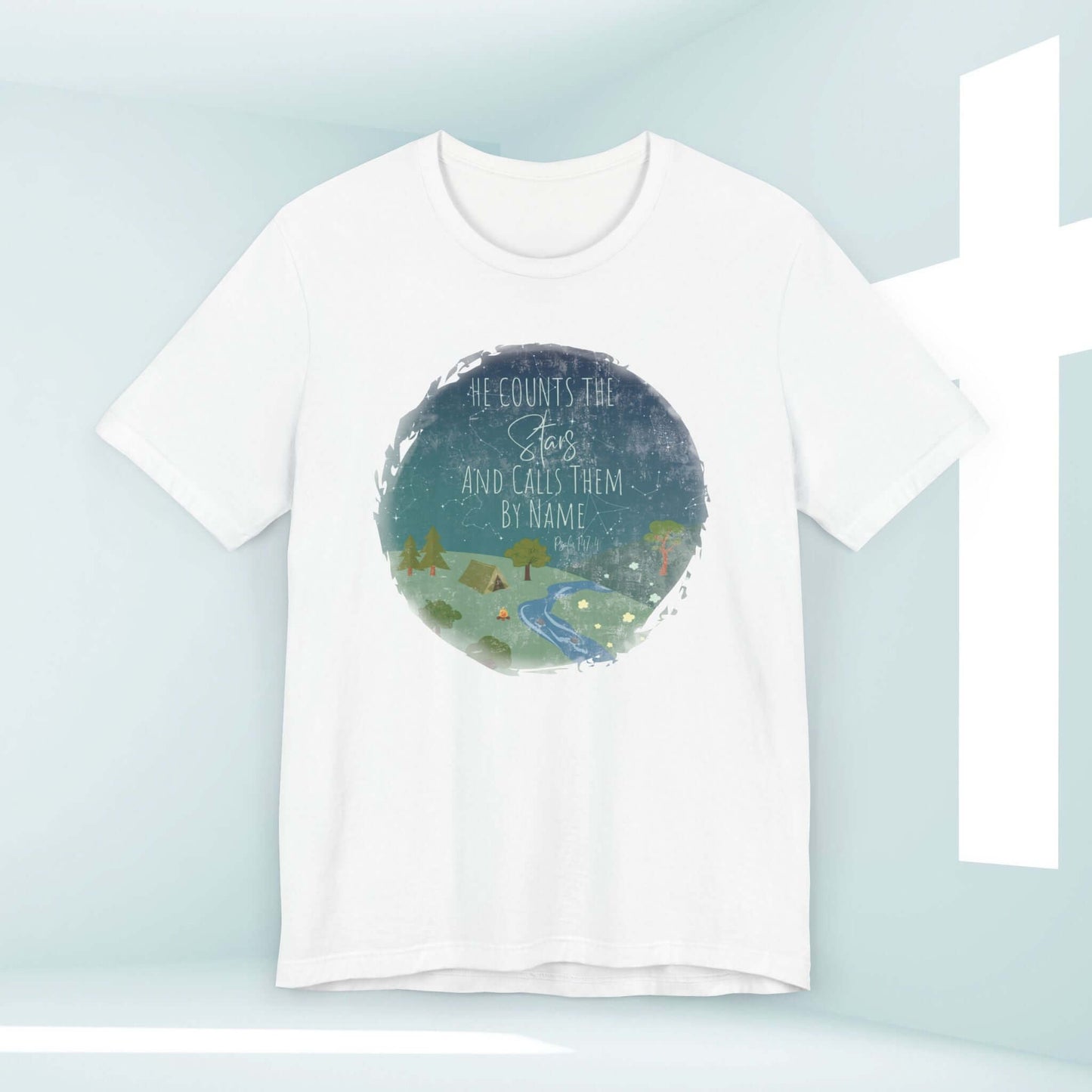 White Christian t-shirt with He Counts The Stars And Calls Them By Name design, featuring a scenic camping nature graphic in blue and green.