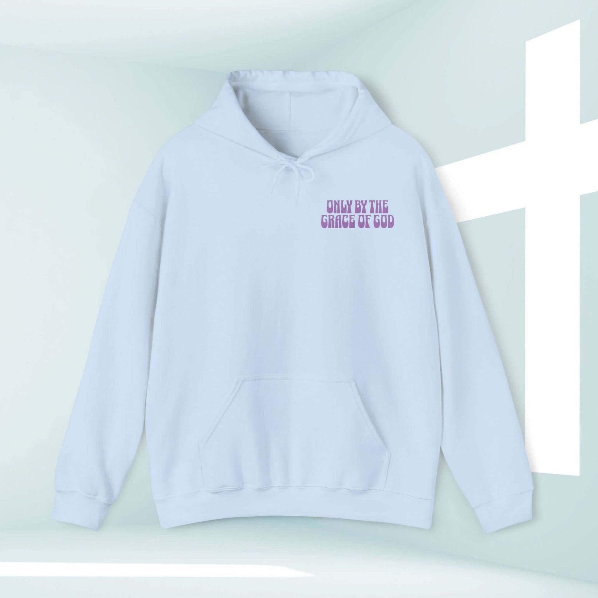 Luxurious Only By The Grace Of God Christian hoodie, faith-based inspirational graphic hooded sweatshirt in light blue, with a cross in the background