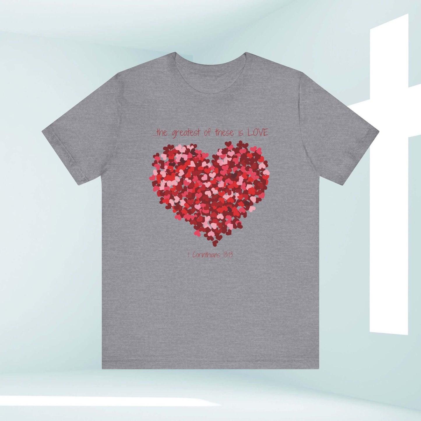 Grey Christian Valentine's Day t-shirt with red heart graphic and "The greatest of these is LOVE" text, perfect for wedding or anniversary gifts.