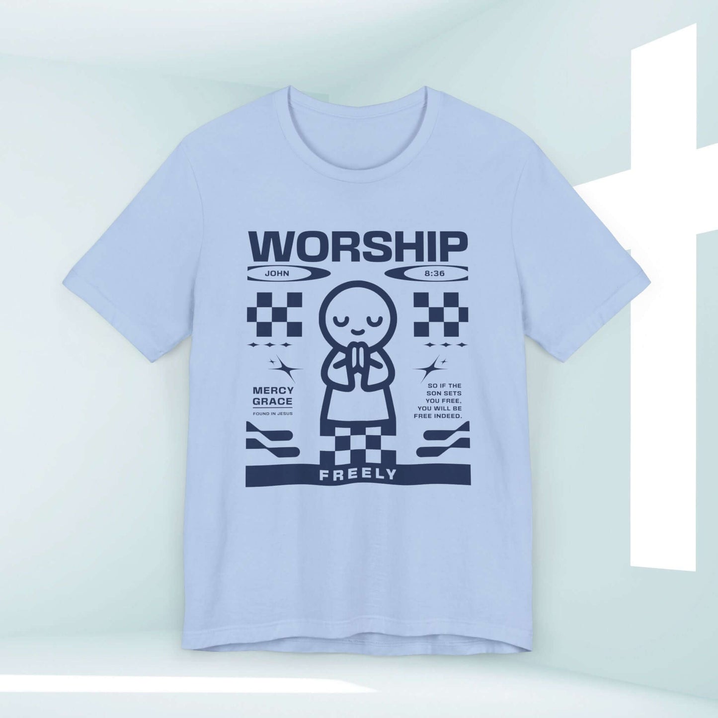 Light blue "Worship Freely" Christian t-shirt with scripture John 8:36, featuring a graphic of a praying figure, perfect for worship and praise.