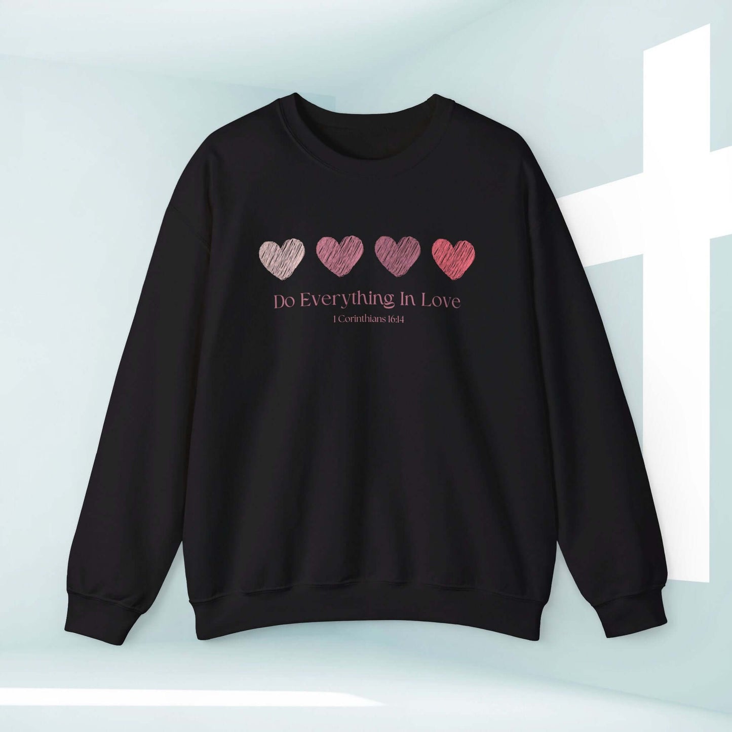 Valentine's Day sweatshirt with heart graphics and faith-based message "Do Everything In Love" in black, perfect for wedding and engagement gifts