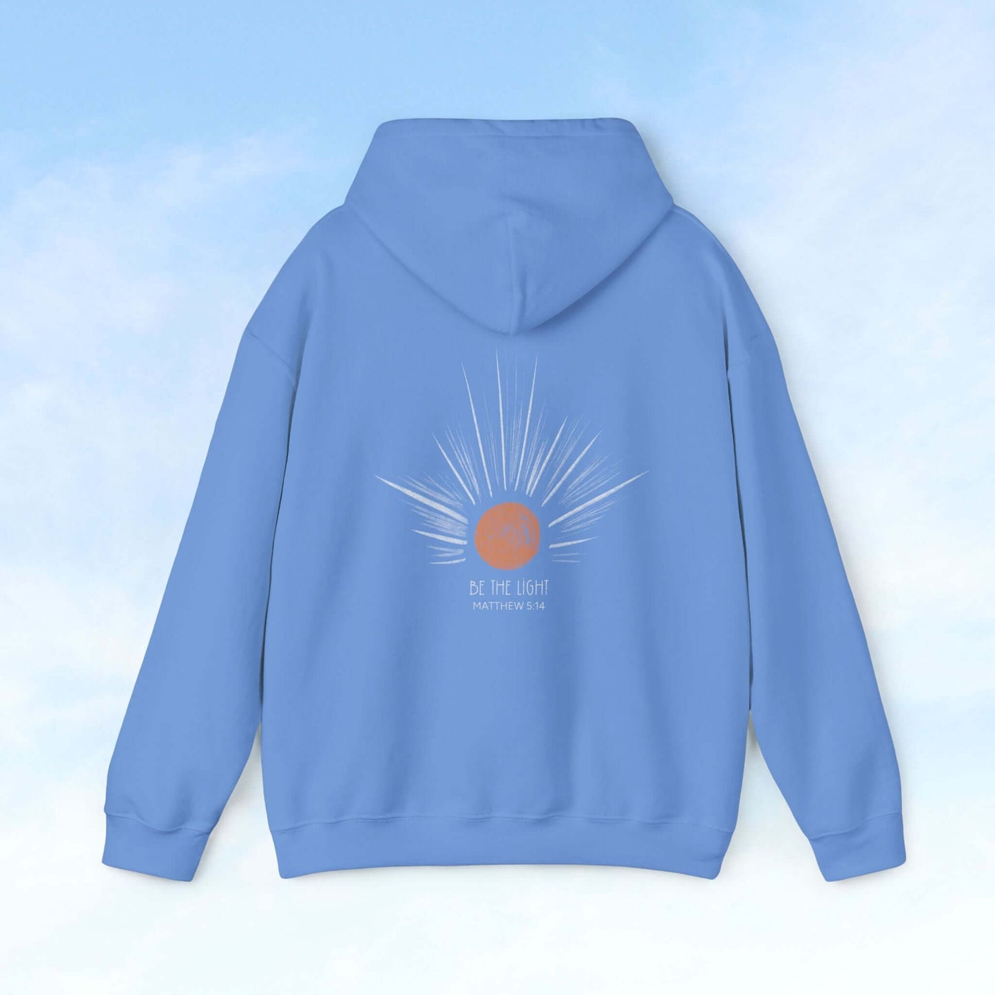 Rear view of blue Be The Light Sunburst Christian hoodie with celestial sun and sun rays graphic, faith-based apparel.