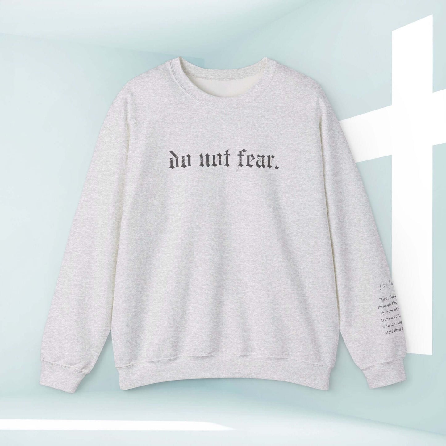 Inspirational Christian sweatshirt with "Do not fear" text, faith-based apparel for believers, offering hope and strength in style.