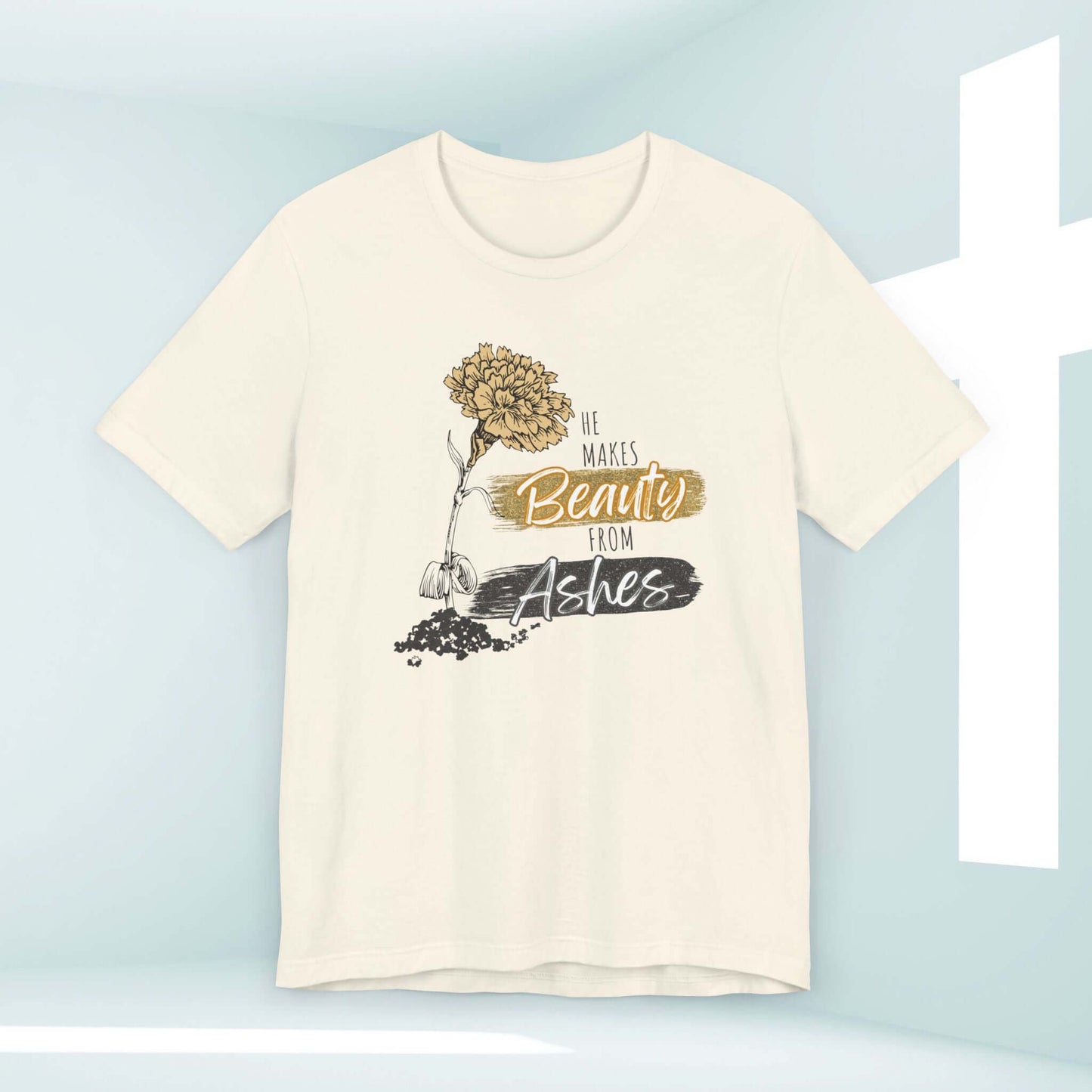 He Makes Beauty From Ashes Women's Christian T-Shirt featuring a flower graphic and Bible verse in a church background.