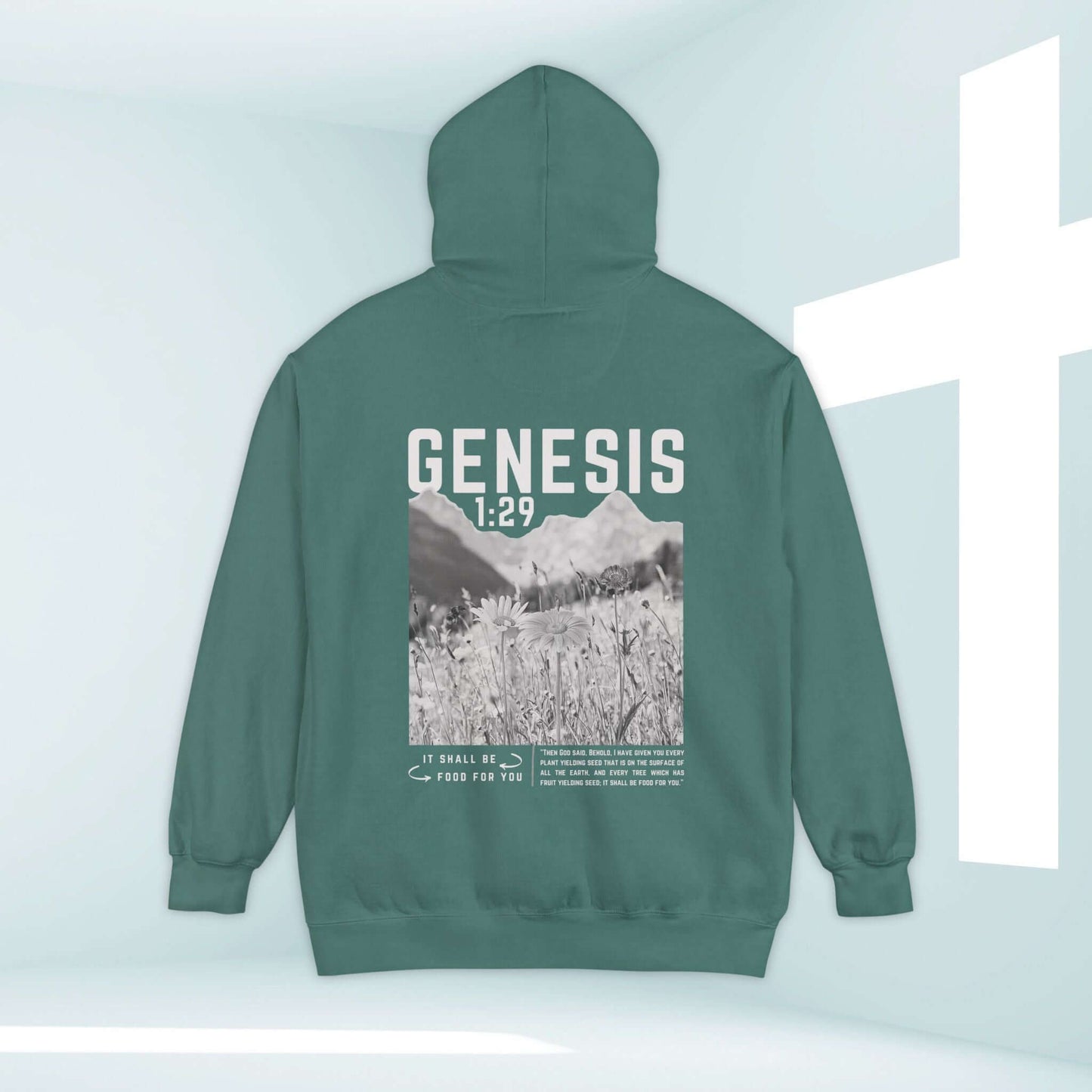 Green Christian hoodie with Genesis 1:29 Bible verse, featuring a mountain and flower field design, perfect for faith-based outdoor enthusiasts.