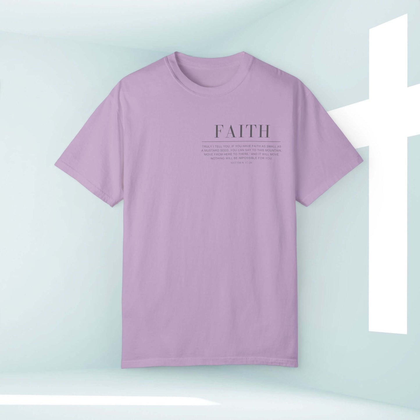 Faith Can Move Mountains Christian shirt with Bible verse in purple against a light background with a white cross, inspirational Christian clothing.