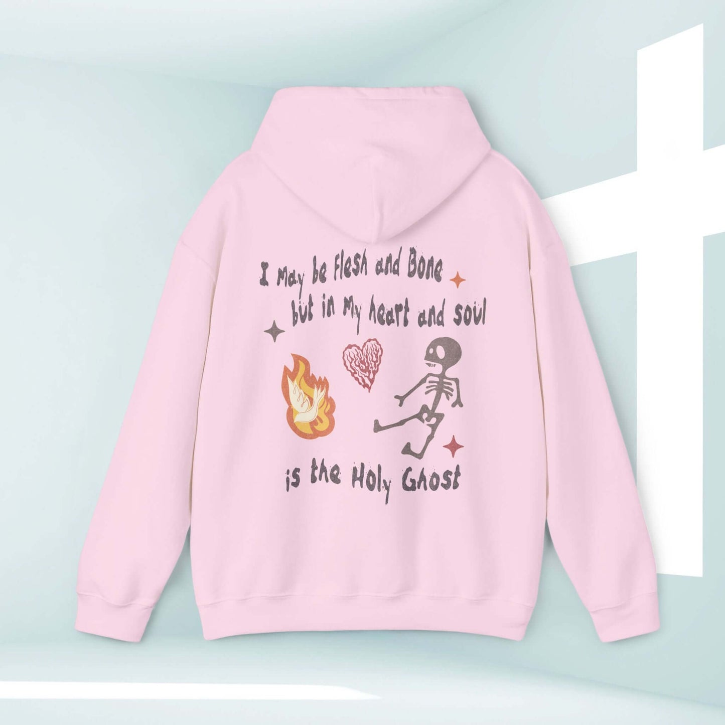 Pink Christian Halloween hoodie with "I May Be Flesh And Bone But In My Heart And Soul Is The Holy Ghost" design and dancing skeleton.