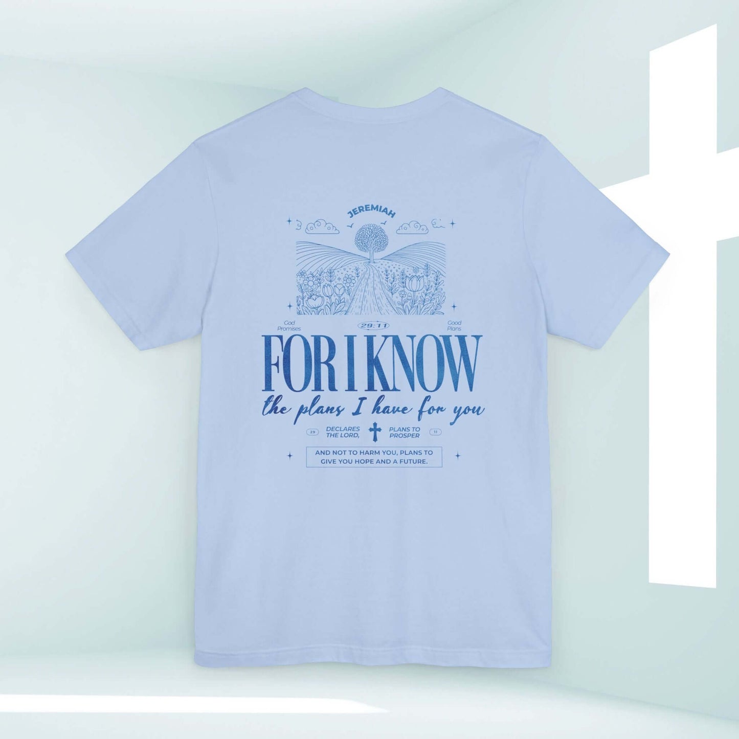 Christian t-shirt with "For I Know The Plans" Bible verse design, nature and mountain theme in a light blue color.