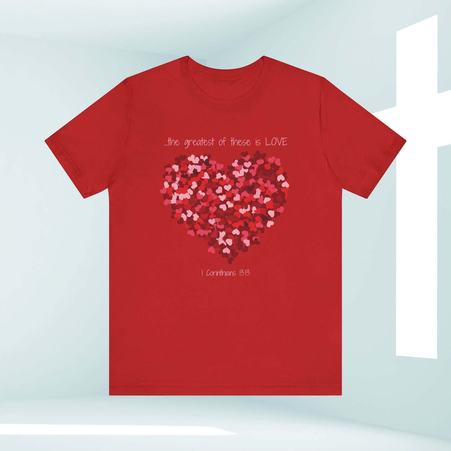 Red Christian Valentine's Day t-shirt featuring a heart design with "The Greatest of These is LOVE" text, perfect for celebrations and daily wear.