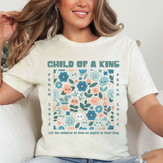 Woman wearing Child Of A King Christian Floral Shirt with Bible Verse, perfect Christian gift and faith apparel for Mother’s Day.