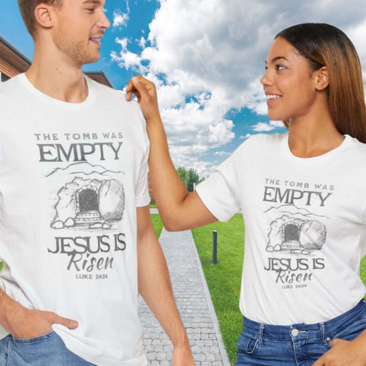 Couple wearing Christian Easter shirts with 'The Tomb Was Empty, Jesus Is Risen' design, ideal for religious Easter clothing and Christian apparel.