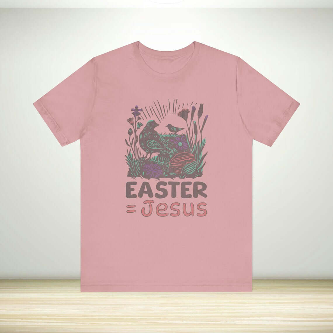 "Christian Easter shirt with 'Easter Equals Jesus' message on pink fabric, ideal religious Easter faith t-shirt and church apparel"