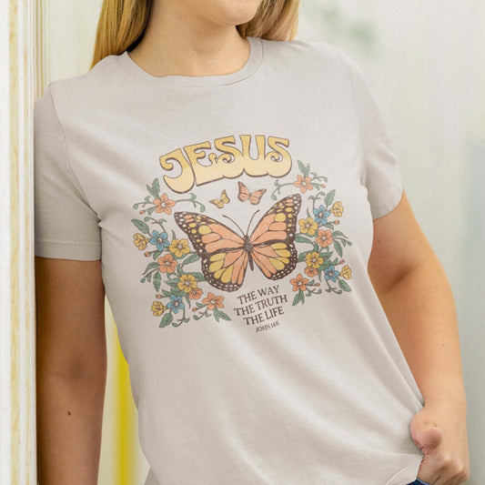 Woman wearing Jesus The Way The Truth The Life butterfly Christian t-shirt with inspirational design and scripture-based message.