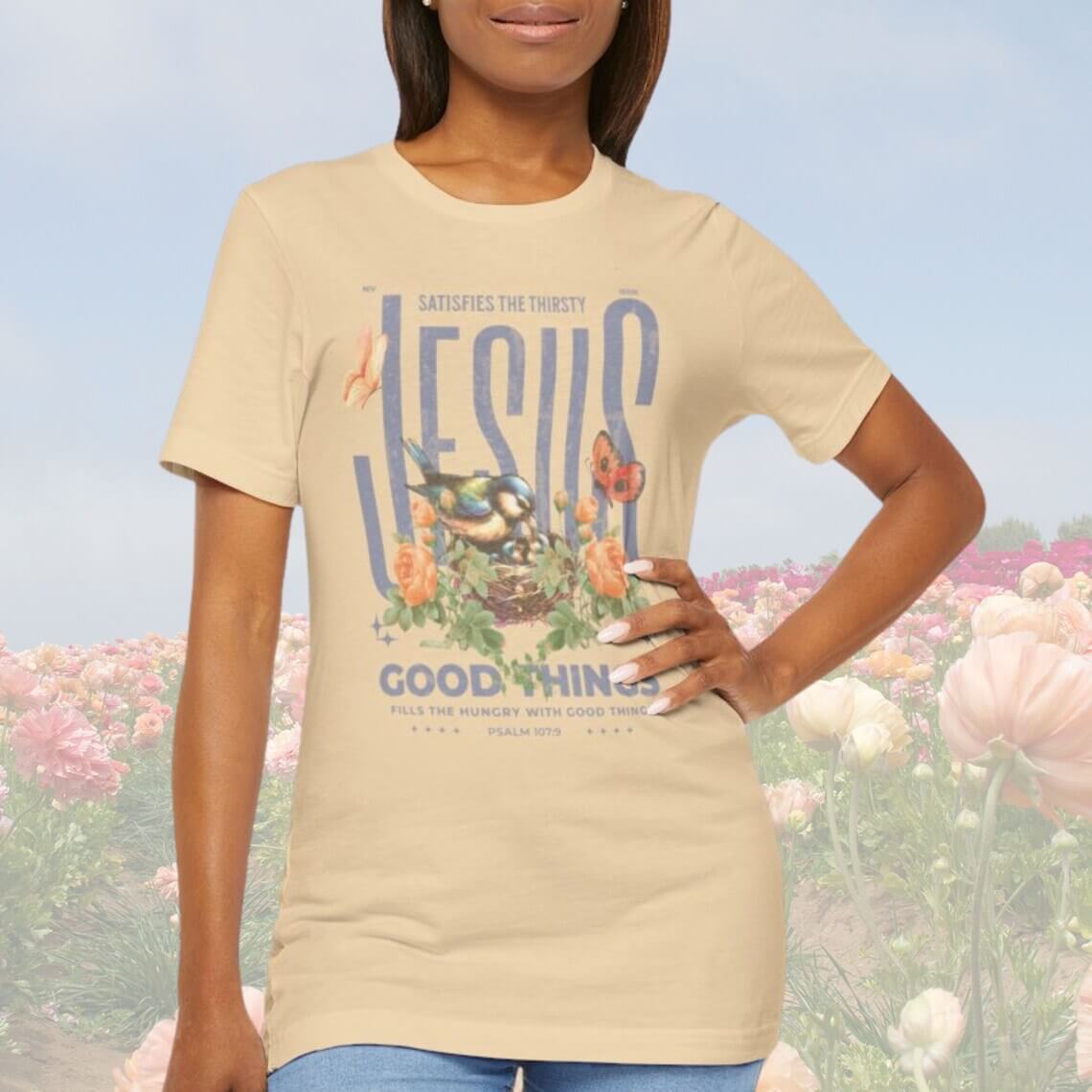 Woman wearing Bird Butterfly Christian T-Shirt with floral design and Jesus Good Things Psalm verse, perfect Mother's Day Christian gift