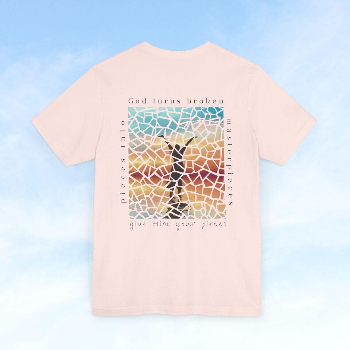 Inspirational "Broken Pieces Into Masterpieces" Christian t-shirt with Bible verse design for faith, church, and worship leaders.